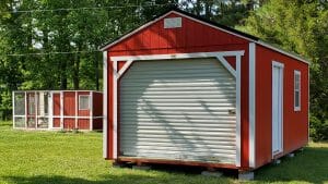 Red garage shed with matching chicken coop
