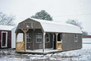 Gray playhouse shed in snow