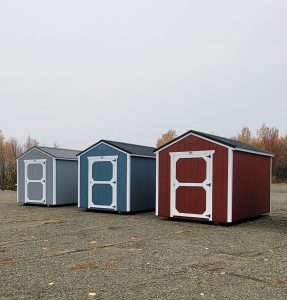 Multiple utility sheds for sale on a local shed dealer's sales lot.